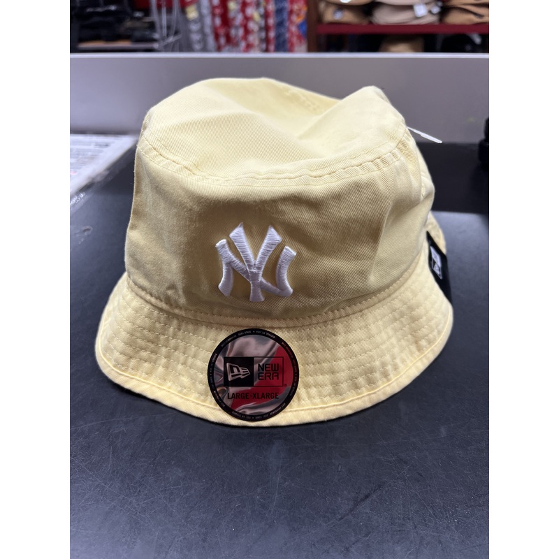 NE ERA BUCKET HAT YELLOW NY 13058263
